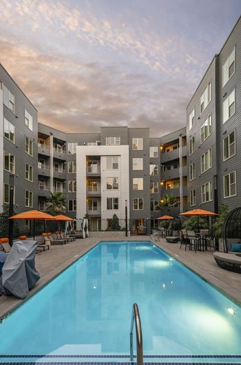 a swimming pool in the middle of an apartment building